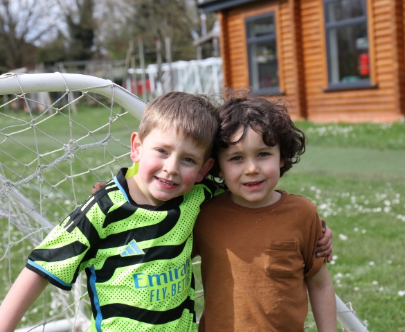 two boys smiling at Football Fun holiday club
