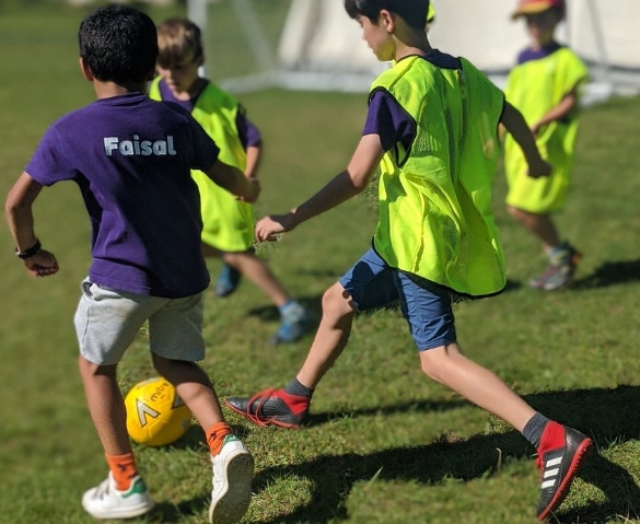 children playing football at Hertfordshire holiday football club