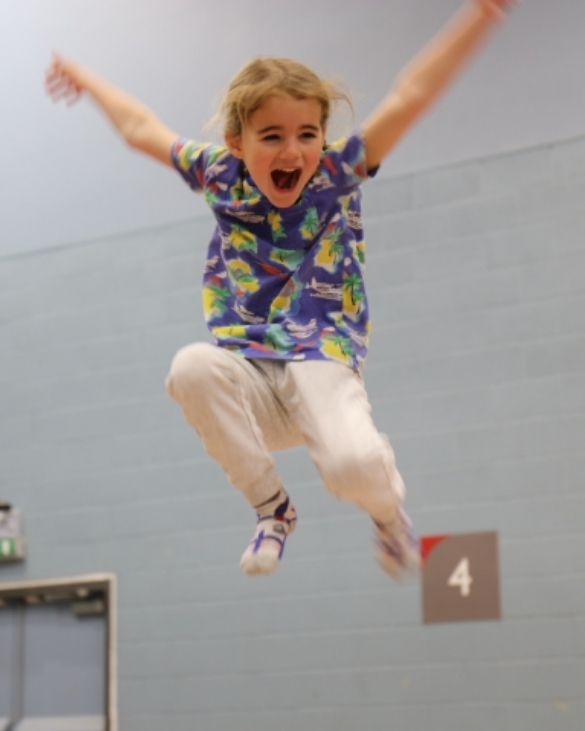 Happy child smiling on a trampoline at Hertfordshire Holiday Club