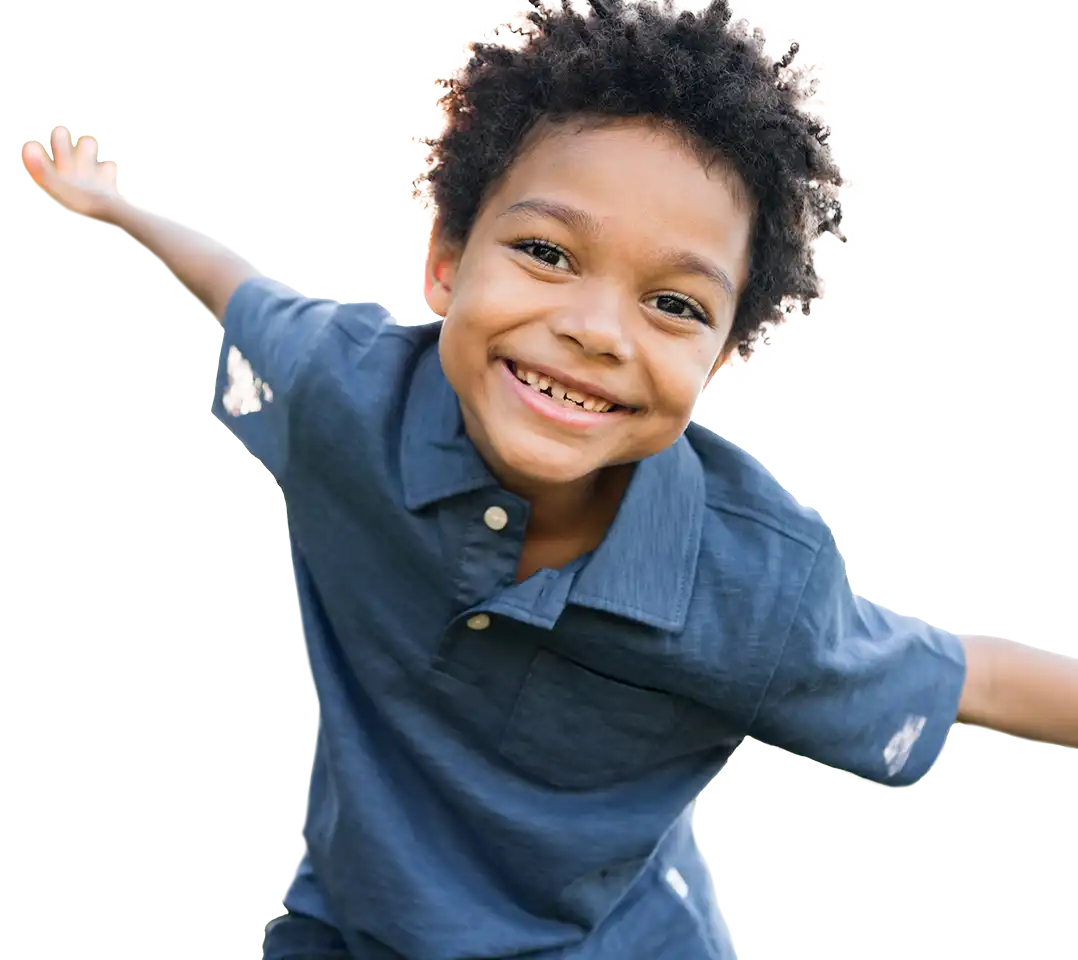 Boy smiling with arms outstretched